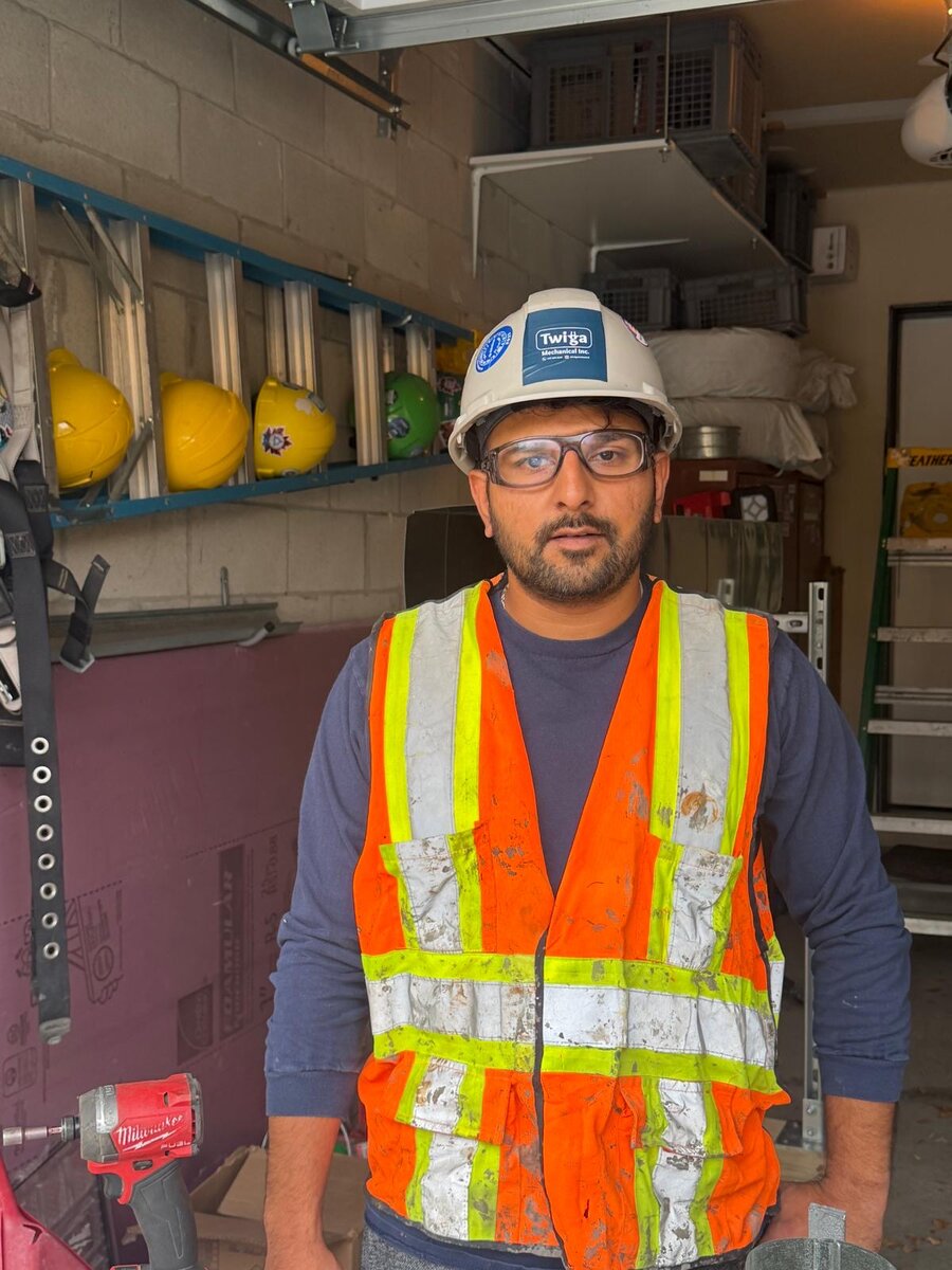 Shamoel Sadikot, founder of Twiga Mechanical, on site in a Twiga hard hat