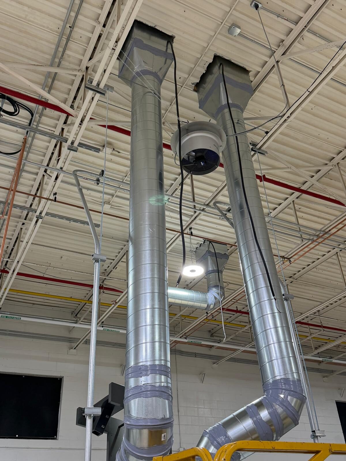 Spiral round duct risers installed by Twiga Mechanical
